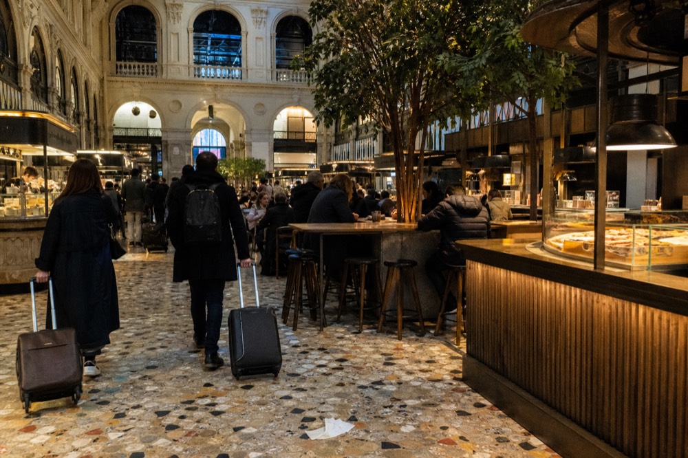 Interior of the food hall with various food stalls and diners