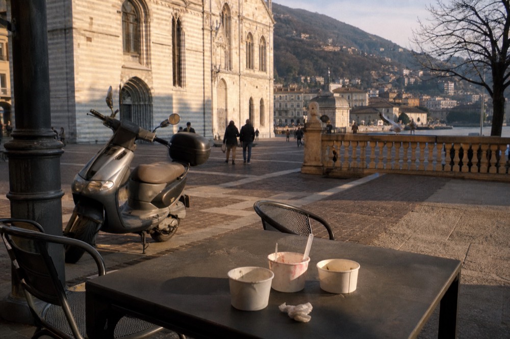 A lakeside square with a cathedral facade in Como