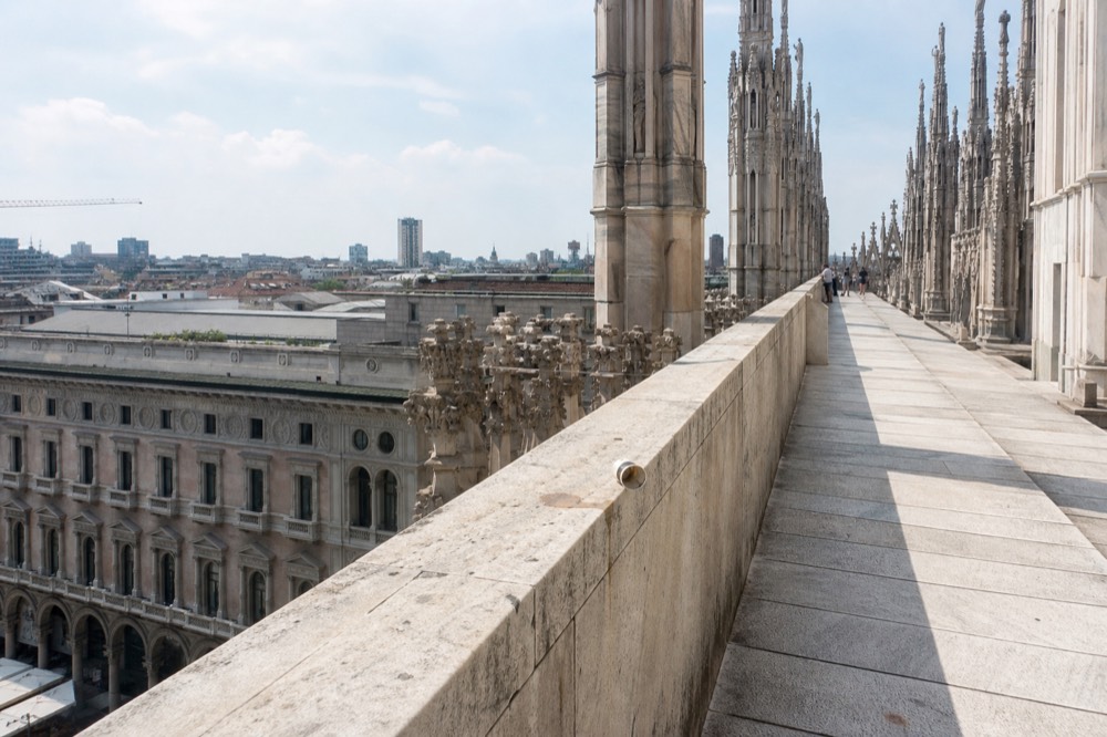 Terrace walkway on a cathedral rooftop above city rooftops